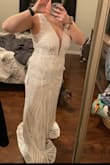 I was looking for a 2nd dress to wear to my reception because my main dress is a little bit heavier and has a long train. After ordering a few different dresses online, this one came in, and immediately, I knew it was perfect. I feel SO GOOD while wearing this dress, and I cannot wait to wear it at my reception. It even comes with a garment bag so I could hide it from my fiancé! The only bad thing I noticed, is that it does shed some sequins, but I won't be wearing it before my wedding so that's not a huge concern for me. - Isabelle H.