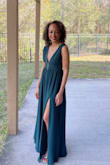 This dress is beautiful and the color is amazing! I love it! I wore it to a black-tie wedding and looked like a million bucks! Got quite a few compliments. It does run a bit big. The shoulders and length needed to be altered. - Juana C.