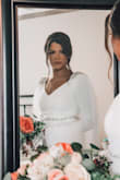 This dress was perfect for my small ceremony!! I have really small boobs so I did add padding and had the shoulders taken up a little. Also had some length taken off.. other than that, it was stunning.
I added a belt and wore a cape veil. I got so many compliments on my dress! It was beautiful! - Kelli A.