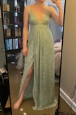 I did size down to a M based on reviews, and I'm glad. I love the color and the texture of this dress. The top is a little complicated to tie by yourself if you want to make sure it stays in place, but it's doable with some patience. I'll probably wear boob tape just to make sure I don't give a peep show while dancing at the reception! Also, I'm 5'8" and this was LONG on me. I think it'll be fine with heels, but shorter ladies be warned! - Kyra M.