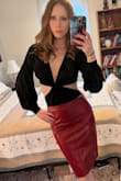Has a fishy, synthetic smell, but only if you really get your nose up close. Small price to pay for a well-fitting, sexy skirt! - Charlotte S.