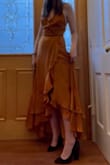 The dress was nice but the top was way too large for me. Even lacing the top up tighter didn't stop it from falling down. The waist fit very nicely and I would've sized down for the top but then the waist would've been too small. Also, I'm 5'7" and wore heels but still found myself stepping on the dress frequently, but I'm sure the length would be an easy alteration fix. Overall, it's very cute but I wouldn't recommend it for smaller chested people. - Lily S.