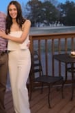 I wore this jumpsuit for my engagement party and got tons of compliments! I usually wear either a small or xs, but decided to order the xs since many of the other reviewers said the pants run long still ended up getting it hemmed and wore it with tall heels. I also will say that even my seamless underwear were visible under this outfit, so I had to do without, but otherwise it turned out perfectly. - Rebecca J.