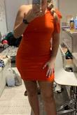 I love this dress! I've worn it for multiple occasions and always get lots of compliments. The color is bright and bold and the one sleeve is a unique look. - Gabby H.