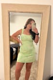Fits true to size, so perfect! The material is thick and of great quality. I bought it for my honeymoon and the light green color will be perfect with a tan. The dress is shorter, which is perfect for short girls like me, but if you are taller it may not be long enough! - Abby S.