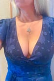 I have been asked to officiate my friend's wedding. She chose this dress for me. The model for this does not show the plunging neckline.  I am NOT that big-breasted, but they are nice. :)
I have put a little lace camisole there to obscure their presence. - Michelle C.