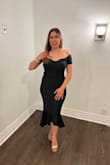 I like the cut of this dress, it's sexy and sophisticated. The material of this dress has a nice stretch, so it's comfortable to wear and does not wrinkle easily. It's a great little black dress to have in your closet! - Coxarely G.