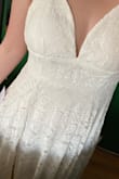 I bought this dress for the simple wedding I am having this summer. I was worried about it running small because my suggested size was the 1X. I'm so glad I looked at the other reviews and bought it anyway. The dress fits perfectly and I love that it doesn't hug my stomach. It's very flattering and I cannot wait to wear it on my wedding day. - Lindsey W.