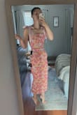Love this little set! The fabric quality feels expensive and the fit is perfect! I have a very long torso, so I was afraid it was going to show too much midriff, but the skirt comes up very high so only the smallest amount of skin shows. The only downside is the skirt is tighter at the knees making it harder to separate your legs too much but isn't a huge issue. - Meridith L.