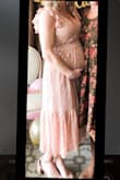 I am 5'5" USUALLY 120 lbs, but am 8.5 months pregnant, so I've packed on some pounds. I ordered a size small, but if i weren't pregnant I could have gone XS. A small fit perfect. I placed the stretchy band above my bump, and this dress looked absolutely beautiful and dainty for the day of my baby shower for my baby girl. I got COUNTLESS compliments. The dress didn't attract static and didn't wrinkle. I love the detail to the bottom of the dress. Can't wait to wear this non-pregnant as well! Highly recommend. - Stephanie H.