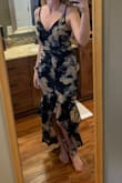 This dress comes off a little more scandy than it seemed in pictures before I bought it. I would have had to have the top "brought in" even though I have a medium bust size. It was way too tight for me to feel comfortable in around my hips and thighs, though. I could order up if you're right in between unless you want it skin tight. Beautiful print. Sad it didn't work out. - Kelly G.