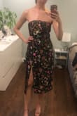 I love the colors, such a different and unique dress, has a nonslip strip to help hold the dress up. Fabric does not have much give and dress runs slightly large; throughout the chest/ waist, size S in pic, XS fit better but then would be uncomfortable after food. - Emma E.