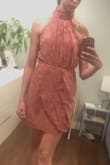 I love the high neck detail and exposed shoulders! Ruching in the front flatter the belly area. Pic was taken straight out of the box so pleats are flattened. - Emma E.