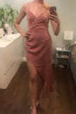 I'm taller than most and it was a little short for me but I do love the asymmetrical hem detail. Wrap front neckline is super flattering! Fabric feels more quality than picture shows, not see through at all - Emma E.