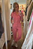 I am OBSESSED WITH THIS COVERALL. the color is absolutely PERFECT!!! Size down because it does run large. If it were available in an XXS I would have gotten that one but this one just fits loose and cute. Don't hesitate BUY this if you're thinking about it. I get so many compliments on it every time I wear it. The material quality is top notch. - Jakii S.
