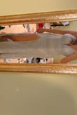 This dress is so pretty! The material feels so great, and it looks so luxurious. It is more sparkly in person than in the picture. It's a little bit stretchy, which is nice since it's a form fitting dress. It is also super supportive up top, and I feel like I could dance all night wearing itmaybe while holding the train lol. The waist is a little big, but I run into that issue with pretty much all of my clothes. The only other issue is that the lining of the dress doesn't totally match up with the lace over top, but that is something I don't think anyone would notice besides me if I wore it out. - Ella W.