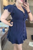 I usually wear a large, but sized up on this one. Still had significant gaping at the buttons (I'm a 34F)...even dress tape wouldn't hold it closed. It's also a little short. - Ashley S.