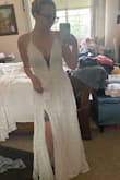 This dress is lovely, I'm eloping and bought a few dresses to try on. This is the only one I didn't send back, while it doesn't scream wedding to me as I'm looking for something a little more high end for the ceremony but decided to keep this for an engagement photo option because it is lovely!

The only Con is that the eyelash lace detailing on the busy does fold over a tad. - Britani C.