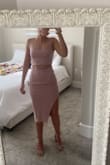 The material is thick enough to flatter and covers enough to be comfortable no matter how you move. The top is a little big on me, as to be expected, but that's fine. I tuck the top into my bra for more separation between the top and the skirt. - Jordan B.