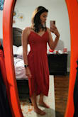 I wore this dress to a rehearsal dinner. The pros, the dress is beautiful and very flattering. For someone who doesn't have a large chest, it still looked great! It's a lightweight material, perfect for Florida outdoor events. The cons, the dress wrinkles easily and steaming did not help to remove them (benefit - wrinkles weren't that noticeable when the dress was on). The only other con is the slit/tulip bottom, if it's windy, you could have some issues. The wind picked up during my event and I had to hold one end down to keep from flashing everyone. - Kelsey L.