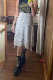 Fits how I expect it would. I wish it had belt loops so It could be worn high-waisted and lower-waisted. I feel like me standing normally makes it look frumpy but with one leg out or me walking it will look decent. - Whitney F.
