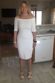 I love how the dress looks, but feel like it is just a bit tight, showing every little bulge, but I've been actively working on losing weight so I'm hoping by the time I wear it in a little less than 2 months, a spanx type slip and a little less weight will make it look perfect.  I'm afraid a size up would then make the top too big, especially the straps, which are just slightly loose now. My daughter said I looked beautiful in it.  Wearing it to elope May 6th!  Will update the review with a photo then! - Linda F.