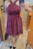 I purchased this dress to wear at a wedding and it's perfect. The color is a burgundy/purple in person and the material is great. 

It fits perfectly! Can't wait to wear it. I did wash it and dry it because it had some wrinkles upon arrival...that worked out without issue. - Aimee R.