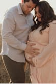 I wore this dress in a size XL for my baby shower and maternity photos at 31 weeks! I am normally a size L/XL not pregnant. It was very comfortable and I got a lot of compliments on it! - Madeline C.