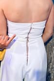 I was at first so happy with this jumpsuit until I had to wear it. When putting this on (30 mins prior to my bridal shower), the zipper broke. This was not because the zipper was forced in any way. It zipped up and split. I've never worn this before and it was brand new & my friends had to safety pin the back so I could wear it! Terrible quality. - Madeline L.