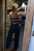 The material is the perfect Thickness for that feel of support but not too heavy. I have a long waist and short legs. In the picture I have on 3 1/2 inch heels. I am 58 years old so I I placed removable cups freely under my breasts and they feel secure.The green is exactly as pictured. I would not change a thing about this jumpsuit. The dot You see on my left hip is the spare button I have not cut out yet - Dawn C.