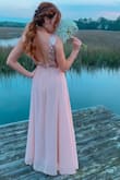 This dress was SO gorgeous, I had a lot of compliments, the back is sexy but not too much, I just had to have the dress cut around 2" because it was long - Lafond C.