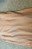 Please size down as this item runs large!!! The color isn't also as seen. It looks like a dark Carmel brown in the photo. It's actually more of a yellow brown. - Ya Y.
