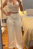 Wearing this for my bachelorette party. Fits well. You can tighten the top with the shoulder straps and back tie. - Jennie R.