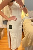 I feel so tall and slim in this it's very balanced between classy and sexy. The slit is veryyyy high up so you have to keep an eye on that but it fits perfectly. Ordered a medium which is my usual size. - Jennie R.