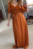 I tried this dress for a wedding I was attending in Mexico. I thought the material and dress were beautiful but it was very long (even with heels) so for the shorter ladies you might run into the same problem. Per the size charts, it was recommended I get a small but it was still too big and I ended up returning it. I didn't have enough time to reorder otherwise I would have tried a smaller size! I also had the issue that others had with the button clasp popping open in the chest. I'm not chesty at all but even a deep breath in it would pop right open. - Lauren W.