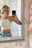 I wanted a cute, but simple white tank to go with some colorful pants I bought through the Brazilian brand "Farm." This shirt is perfect: looks good, breathes, goes with everything.
If you have small boobs, you'll want to size down. I got the smallest size possible and it still felt a little "roomy." But, hey, it looks good and is comfortable! What else can you ask for? - Philippa L.