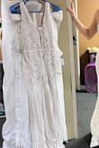 This dress was beautiful and of decent quality. I should have ordered a large because, with my large bust, it is almost always a must. This dress fit well, except there was too little room in the bust. I highly doubt even ordering a size up would have been enough for my tatas. Ps. The length would have still been a bit too long for me at 5'5 1/2" even with heels. Sorry forgot to take a pic with it on. - Barbara M.