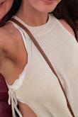 I am obsessed with this top! Totally comfortable, lightweight & adorable. I love her slit at the side. Is a bit see-through, I just wore a cute bralette underneath. - Christa H.