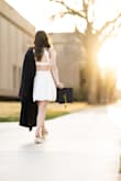 The dress worked perfectly for my college graduation photos and I will also be wearing this during the ceremony. Just be careful on tucking the hanging straps in good because they will pop out. - Michelle W.