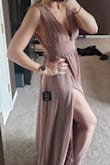 The dress is flowy and flattering. It does run pretty big, so I would size down. The only area, I'd be nervous about sizing down for would be the bust, where it zips in the back. I'm 5'9" and the dress still reached the floor, so it is long. The bust area is pretty free, so maybe look into buying tape to hold the puppies in. You could also pay to get it altered at the shoulders, because the top is larger.
The reason I didnt give 5 stars is because the color is a lot different than pictured. The color has a lot of purple in it. - Kylie N.