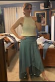 It's a loose mesh and see-through just like depicted by the model, I wear a strapless but if you don't mind see through it's a great festival top where they wear a lot less! I tucked and pulled a little but it can be worn untucked with jeans or shorts - Mary C.