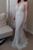 This is one of two dresses I ordered, and it's such a hard choice I'm hanging on to both! I feel like the beading gives such a flattering shape. It's great quality, and my mom couldn't believe the price tag when I showed her! It's a steal. It feels really good on, and fit great out of the box. I'd just need to get it hemmed. Just overall a great buy. - Er M.