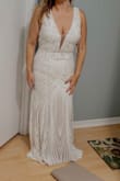 I fell in love the first moment I saw this dress and had to ordered it. Fits beautifully and the fabric has so much detail that makes the dress look way more expensive than its price. It's a little bit long on me, but nothing that can't be fixed. I can't wait to wear it for my upcoming wedding!!! - Gina M.