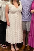 This dress is so flattering! The waist is stretchy which made it so comfortable. I wore a large but probably should have done xl as it was a little revealing on my bust. The slit was perfect and not too high even when sitting down. Not see through at all for a white dress which was a plus! I would recommend nude undergarments though.
I got so many compliments! Great dress definitely recommend! - Kasey P.