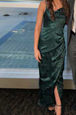 Wore this for a formal event and loved it. Super comfortable. It's a very flattering fit for those with smaller busts. It was a little loose around my hips but I would not have gone down a size. - AshLeigh S.