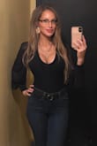 Perfect date night top. It's elegant and sexy. The sheer sleeves with a slight balloon add an extra elegance to it. The body has some stretch to it and the waist is slender (true to fit). Has a relatively deep neck. - Elizabeth H.
