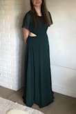 This dress fit my daughter well. She wears a size 10/12 generally and we ordered her a large. The waist cutouts are not "sexy" but really update the dress. It was great for prom, but I could easily see it work for a bridesmaid too. LOVE! - Patrick C.