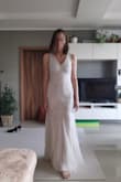 I ordered one size smaller from my usual size, cause it seemed quite a loose cut. And it fits great.
The dress is comfortable, the beading doesn't fall off. Good lenght for my height without high heels.
Mind that the colour is not white, but rather creamy.
I was looking for something rather simple and I wasn't disappointed. I find it really beautiful. - Miriama S.