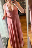This dress is really gorgeous and has a great, flattering fit. I didn't need a bra for it, but you could easily wear one that plunged low enough in the front. The dress is exactly as pictured. You might want Spanx if you carry weight in your tummy/hips, but the velvet is also thick enough and the dress is heavy enough to really lay well. Highly recommend. I think the sizing is probably somewhat forgiving since it's a stretchy material. - Maggie C.