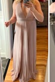 I really liked this dress a lot, but at 5'6 with 3.5" heels, I was tripping on it. It's gorgeous rose gold with a flattering fit. No special undergarments are required. - Maggie C.